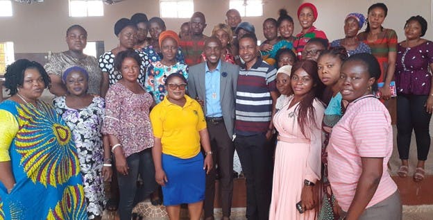 A group of smiling Nigerian educators